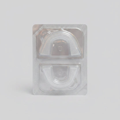 Bottom of Toothfloof Orawrap Clear plastic packaging with a white background