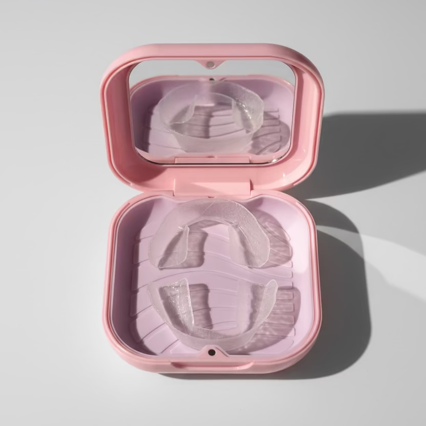 Pink case with clear dental retainers